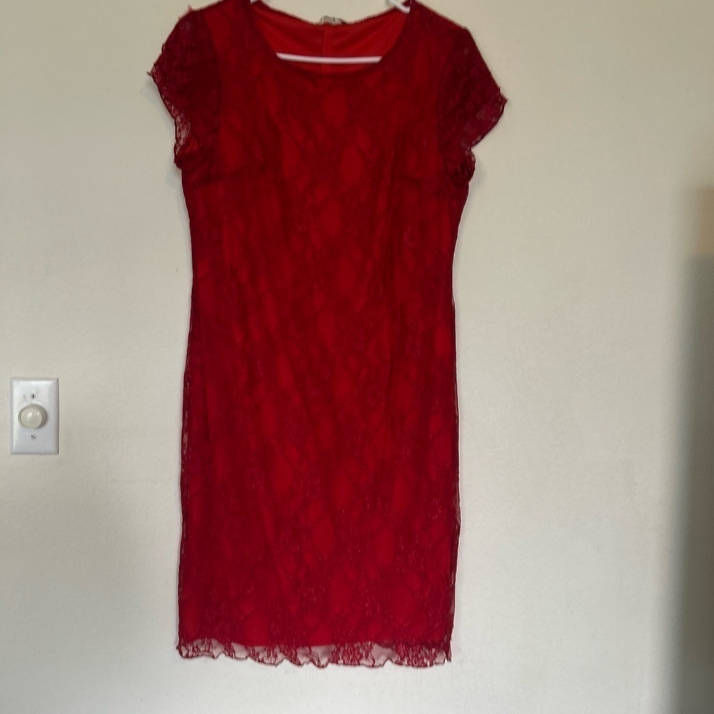 Tiana B. Medium red dress with lace detail.